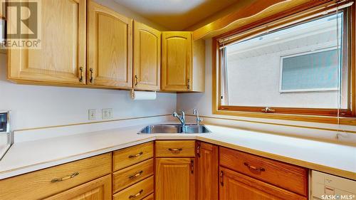 29 Kensington Lane, Regina, SK - Indoor Photo Showing Kitchen With Double Sink