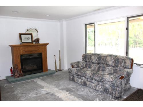 1311 Ida Road, Cranbrook, BC - Indoor Photo Showing Living Room With Fireplace