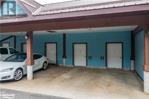 Exclusive covered parking and storage unit - 130 Steamship Bay Road Unit# 305, Gravenhurst, ON - Indoor Photo Showing Garage