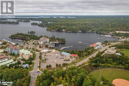 Aerial views of the Wharf - 130 Steamship Bay Road Unit# 305, Gravenhurst, ON - Outdoor With Body Of Water With View