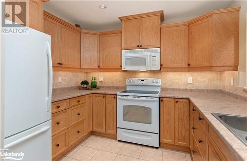 Spacious kitchen with ample storage - 130 Steamship Bay Road Unit# 305, Gravenhurst, ON - Indoor Photo Showing Kitchen