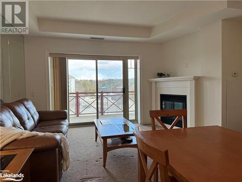 Main living area - 130 Steamship Bay Road Unit# 305, Gravenhurst, ON - Indoor With Fireplace