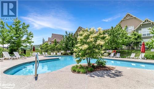 115 Fairway Court Unit# 211, The Blue Mountains, ON - Outdoor With In Ground Pool With Backyard
