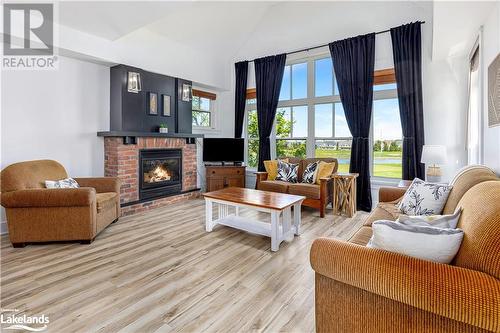 115 Fairway Court Unit# 211, The Blue Mountains, ON - Indoor Photo Showing Living Room With Fireplace