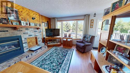 210 Main Street, Wawota, SK - Indoor Photo Showing Living Room With Fireplace