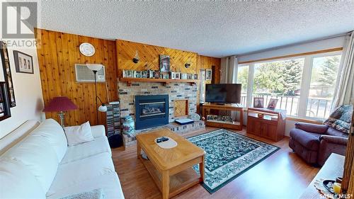 210 Main Street, Wawota, SK - Indoor Photo Showing Living Room With Fireplace