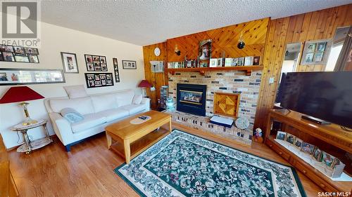 210 Main Street, Wawota, SK - Indoor Photo Showing Living Room With Fireplace