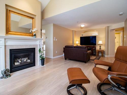 307-5625 Edgewater Lane, Nanaimo, BC - Indoor Photo Showing Living Room With Fireplace