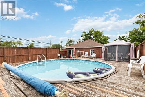 64 Mcsweeney Ave, Moncton, NB - Outdoor With Above Ground Pool With Backyard