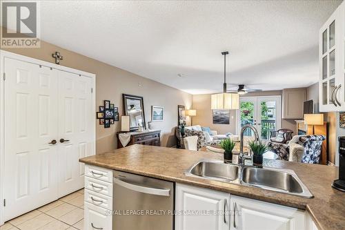 324 - 2030 Cleaver Avenue, Burlington, ON - Indoor Photo Showing Kitchen With Double Sink