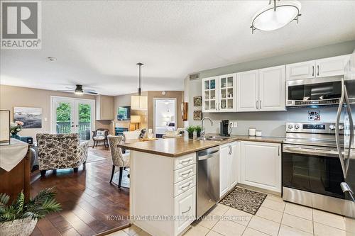 324 - 2030 Cleaver Avenue, Burlington, ON - Indoor Photo Showing Kitchen With Double Sink