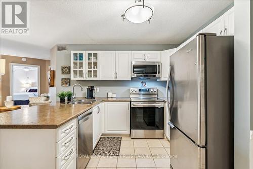 324 - 2030 Cleaver Avenue, Burlington, ON - Indoor Photo Showing Kitchen With Stainless Steel Kitchen With Double Sink