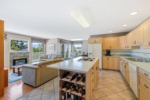 800 Westpoint Drive, Kelowna, BC - Indoor Photo Showing Kitchen With Fireplace With Double Sink