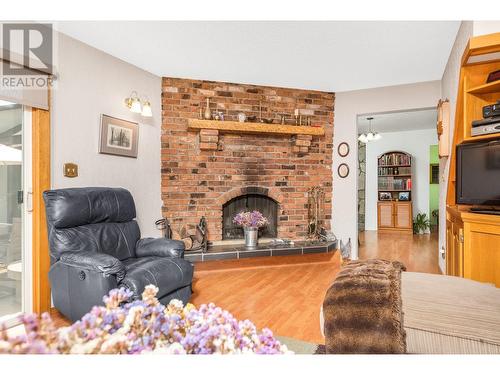 6775 L&A Road, Vernon, BC - Indoor Photo Showing Living Room With Fireplace