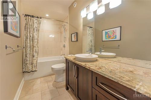 Family bathroom located between the two secondary bedrooms, features a spacious vanity, granite counters & soaker tub. - 6163 Pebblewoods Drive, Ottawa, ON - Indoor Photo Showing Bathroom