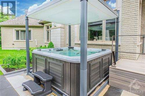 Relax in your Artic spa hot tub complete with heated mat for inclement weather & conveneint auto lid. - 6163 Pebblewoods Drive, Ottawa, ON - Outdoor With Exterior