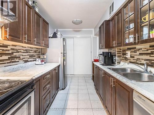 816 - 370 Dixon Road, Toronto, ON - Indoor Photo Showing Kitchen With Double Sink