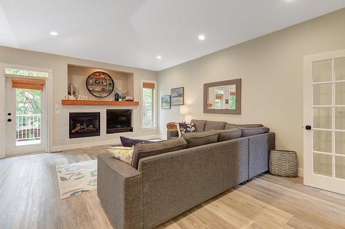 4858 Carmel Crescent, Kelowna, BC - Indoor Photo Showing Living Room With Fireplace