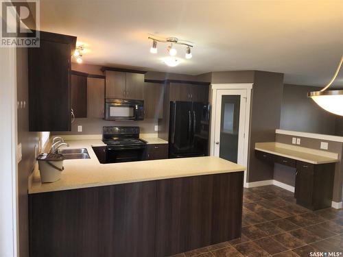 4604 James Hill Road, Regina, SK - Indoor Photo Showing Kitchen With Double Sink