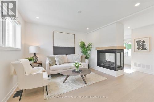 22 Donora Drive, Toronto (Crescent Town), ON - Indoor Photo Showing Living Room With Fireplace