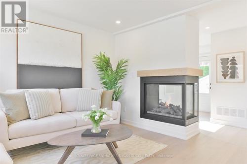 22 Donora Drive, Toronto (Crescent Town), ON - Indoor Photo Showing Living Room With Fireplace