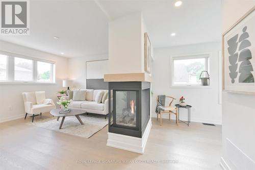 22 Donora Drive, Toronto (Crescent Town), ON - Indoor Photo Showing Living Room With Fireplace