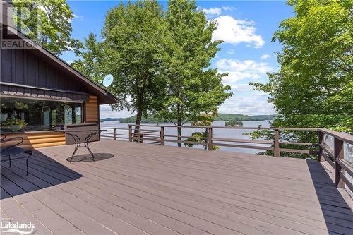 Ample space for outdoor entertaining - 303 Etwell Road, Huntsville, ON - Outdoor With Body Of Water With Deck Patio Veranda