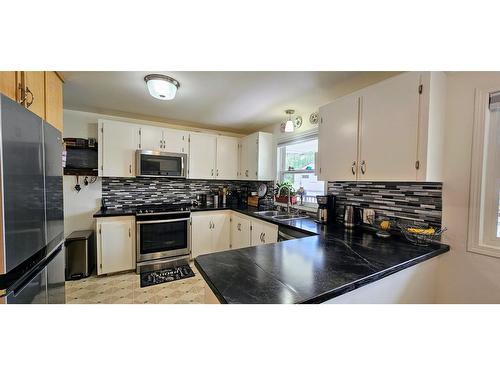 4983 Mcgrath Avenue, Canal Flats, BC - Indoor Photo Showing Kitchen With Stainless Steel Kitchen With Double Sink