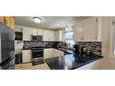 4983 Mcgrath Avenue, Canal Flats, BC  - Indoor Photo Showing Kitchen With Stainless Steel Kitchen With Double Sink 