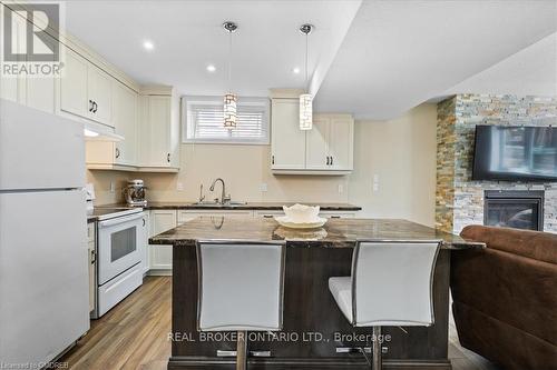460 Westcroft Drive, Waterloo, ON - Indoor Photo Showing Kitchen With Fireplace