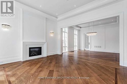 20 Berkindale Drive, Toronto, ON - Indoor Photo Showing Living Room With Fireplace