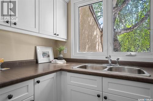 7 1128 Mckercher Drive, Saskatoon, SK - Indoor Photo Showing Kitchen With Double Sink