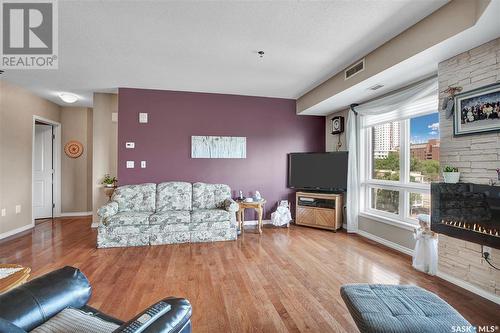 506 902 Spadina Crescent E, Saskatoon, SK - Indoor Photo Showing Living Room With Fireplace