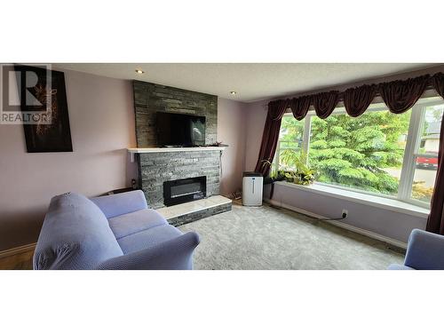 7887 Thompson Drive, Prince George, BC - Indoor Photo Showing Living Room With Fireplace