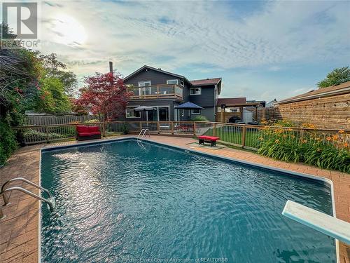 8235 Riverside Drive East, Windsor, ON - Outdoor With In Ground Pool