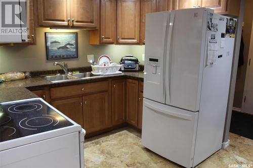 21 228 3Rd Street, Weyburn, SK - Indoor Photo Showing Kitchen With Double Sink