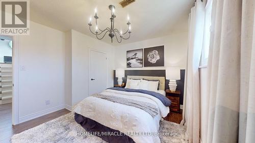 76 Eglinton Street, Kawartha Lakes, ON - Indoor Photo Showing Bedroom With Fireplace