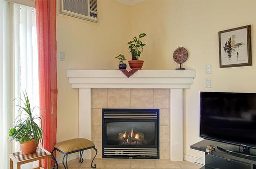 101-307 Whitman Road, Kelowna, BC - Indoor Photo Showing Living Room With Fireplace