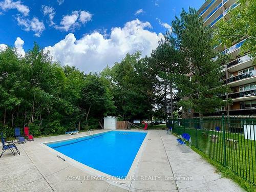 303-3145 Queen Frederica Dr, Mississauga, ON - Outdoor With In Ground Pool