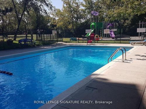 303-3145 Queen Frederica Dr, Mississauga, ON - Outdoor With In Ground Pool With Backyard