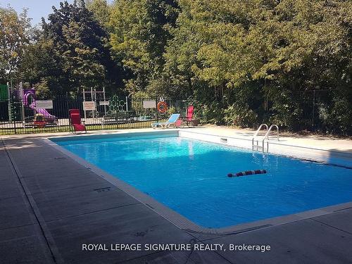 303-3145 Queen Frederica Dr, Mississauga, ON - Outdoor With In Ground Pool