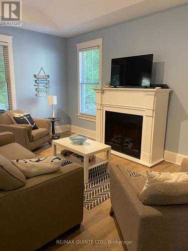 201 - 36 Hollow Lane, Prince Edward County, ON - Indoor Photo Showing Living Room With Fireplace