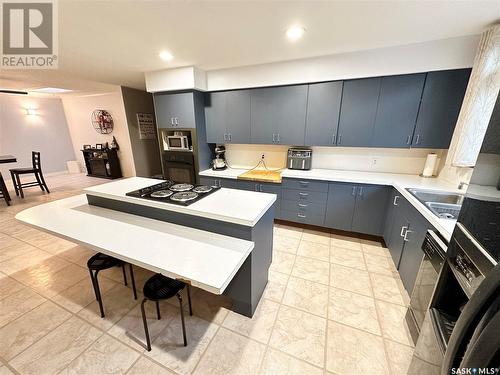 220 Ash Drive, Weyburn, SK - Indoor Photo Showing Kitchen With Double Sink