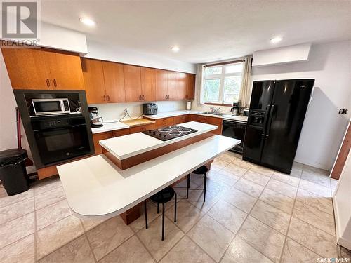 220 Ash Drive, Weyburn, SK - Indoor Photo Showing Kitchen With Double Sink