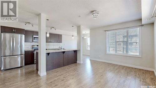 305 5303 Universal Crescent, Regina, SK - Indoor Photo Showing Kitchen With Double Sink