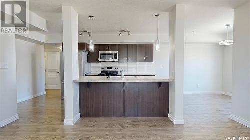 305 5303 Universal Crescent, Regina, SK - Indoor Photo Showing Kitchen