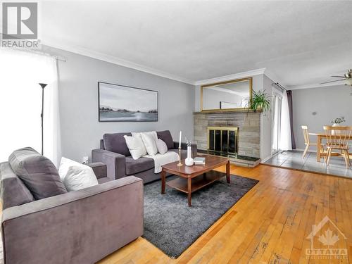 2576 Roman Avenue, Ottawa, ON - Indoor Photo Showing Living Room With Fireplace