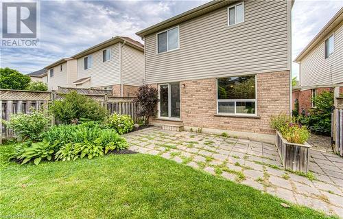 Walkout from the breakfast area to the stone patio in the back yard - 531 Commonwealth Crescent, Kitchener, ON - Outdoor With Exterior