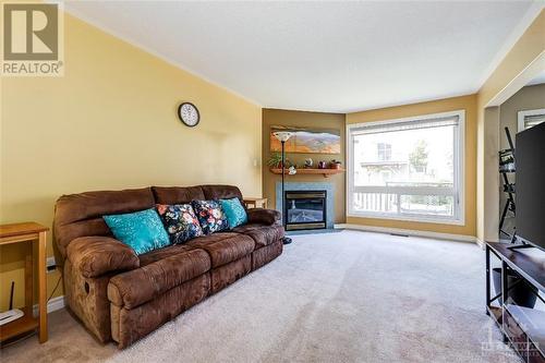 34 Wallsend Avenue, Kanata, ON - Indoor Photo Showing Living Room With Fireplace