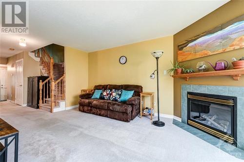 34 Wallsend Avenue, Kanata, ON - Indoor Photo Showing Living Room With Fireplace